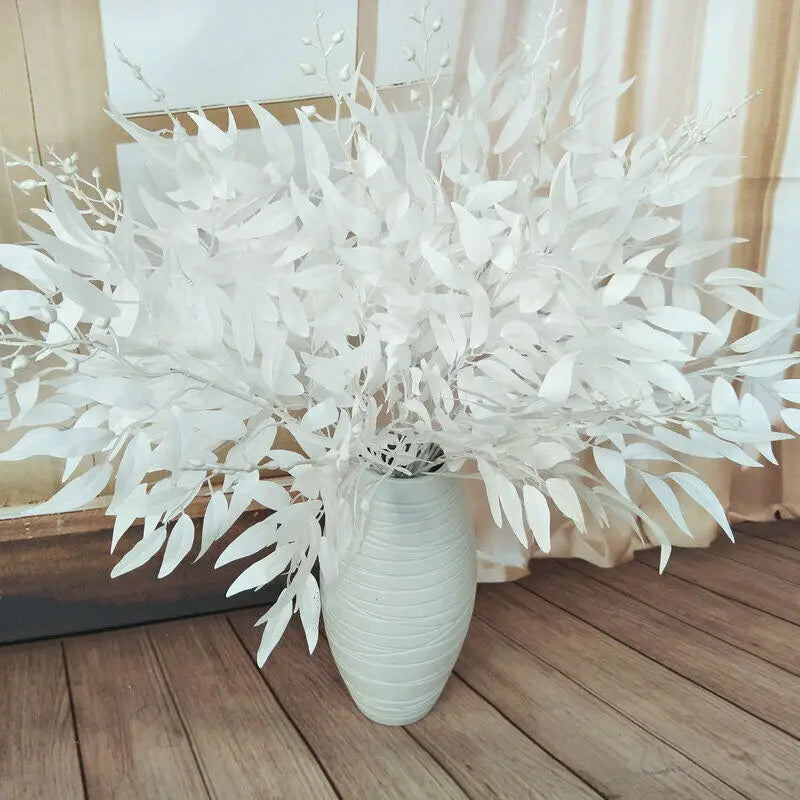 Artificial white flower decoration in a textured vase, perfect for home or event styling