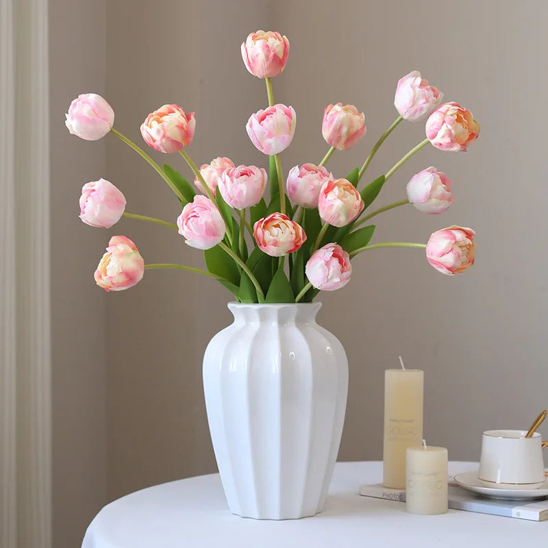 Elegant white vase with vibrant pink tulips, perfect for home decoration or gifts