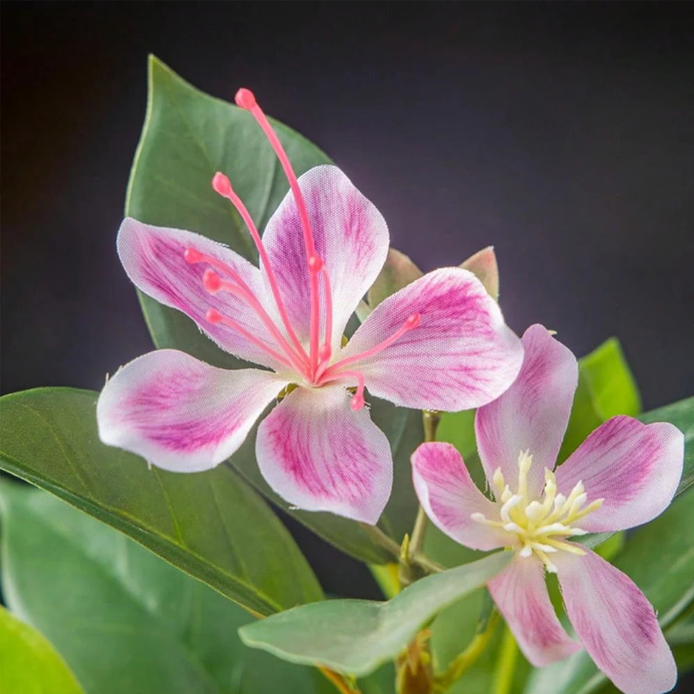 Beautiful artificial azaleas indoor decor with pink and white flowers and lush green leaves