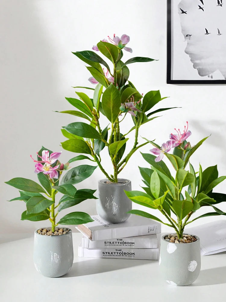 Set of three artificial azaleas indoor decor in modern gray pots for elegant home styling