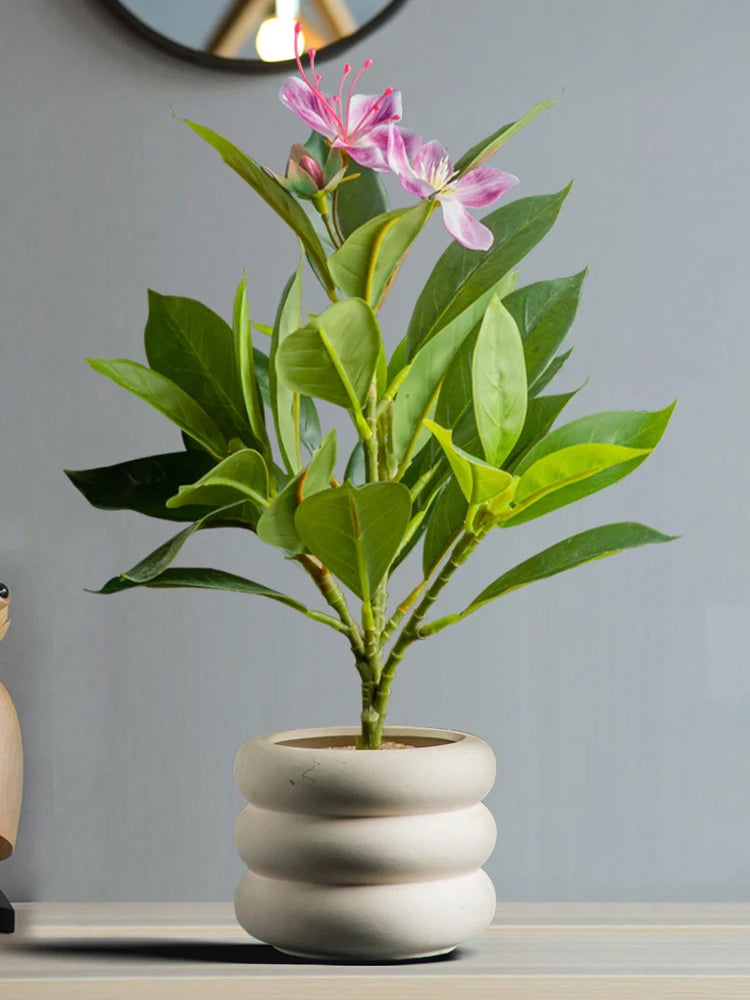 Artificial azaleas indoor decor in a stylish planter for enhancing home aesthetics