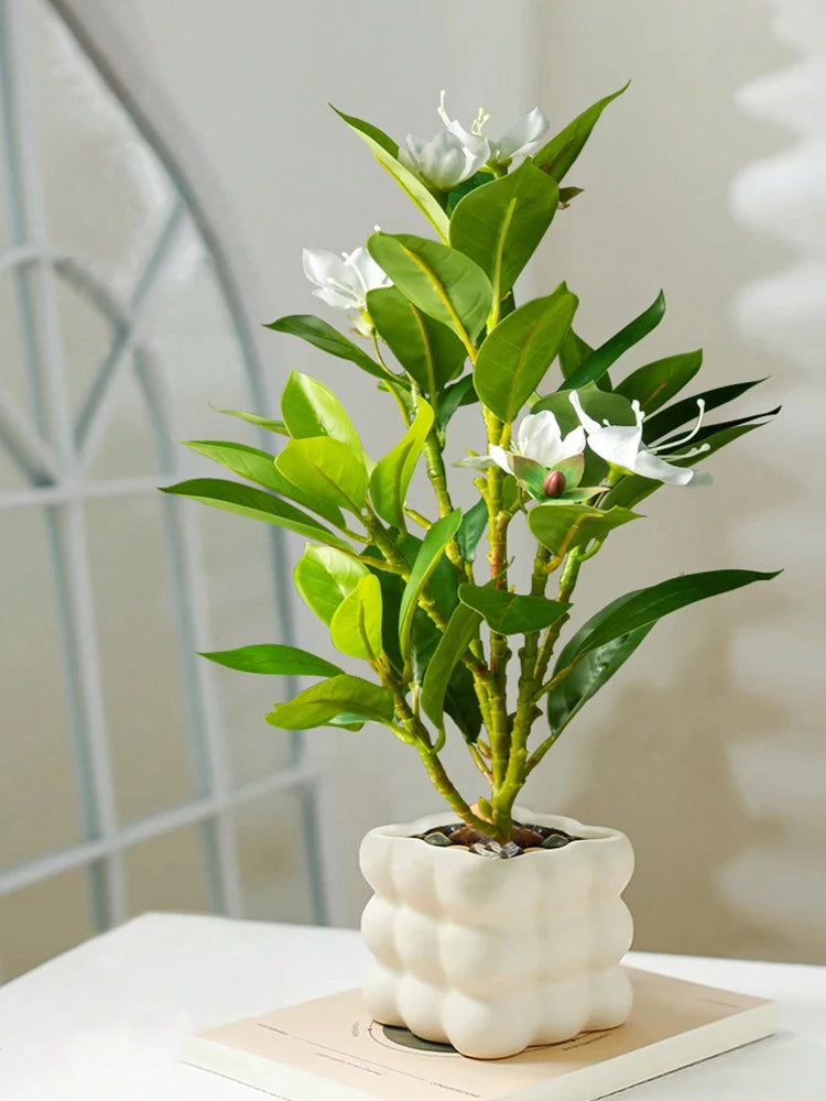 Beautiful artificial azaleas indoor decor in a modern white pot for vibrant home styling