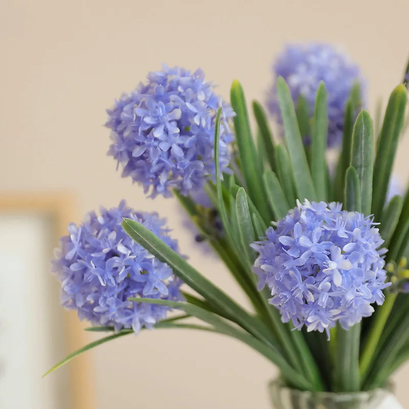 Beautiful artificial dandelion bouquet in purple, perfect for home decor or gifting
