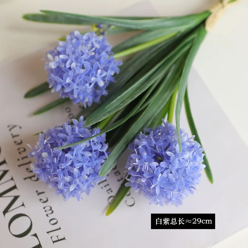 Artificial dandelion bouquet in lavender with realistic petals and green leaves for home decor