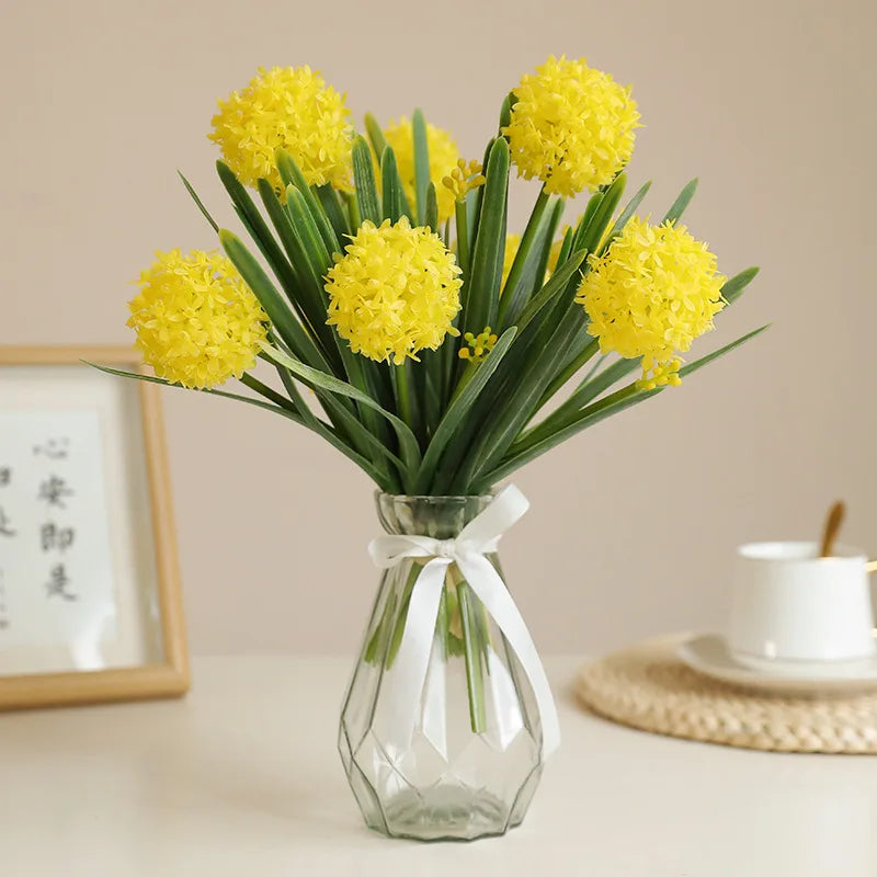 Artificial dandelion bouquet featuring vibrant yellow flowers and green leaves in a decorative vase