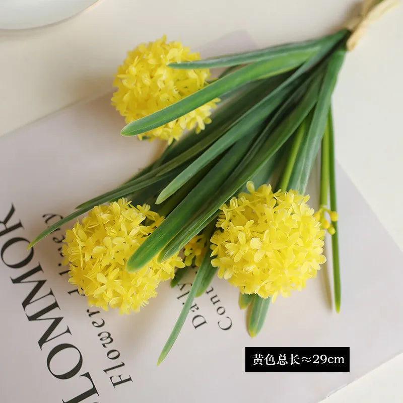 Artificial dandelion bouquet featuring vibrant yellow blooms with green leaves for home decor