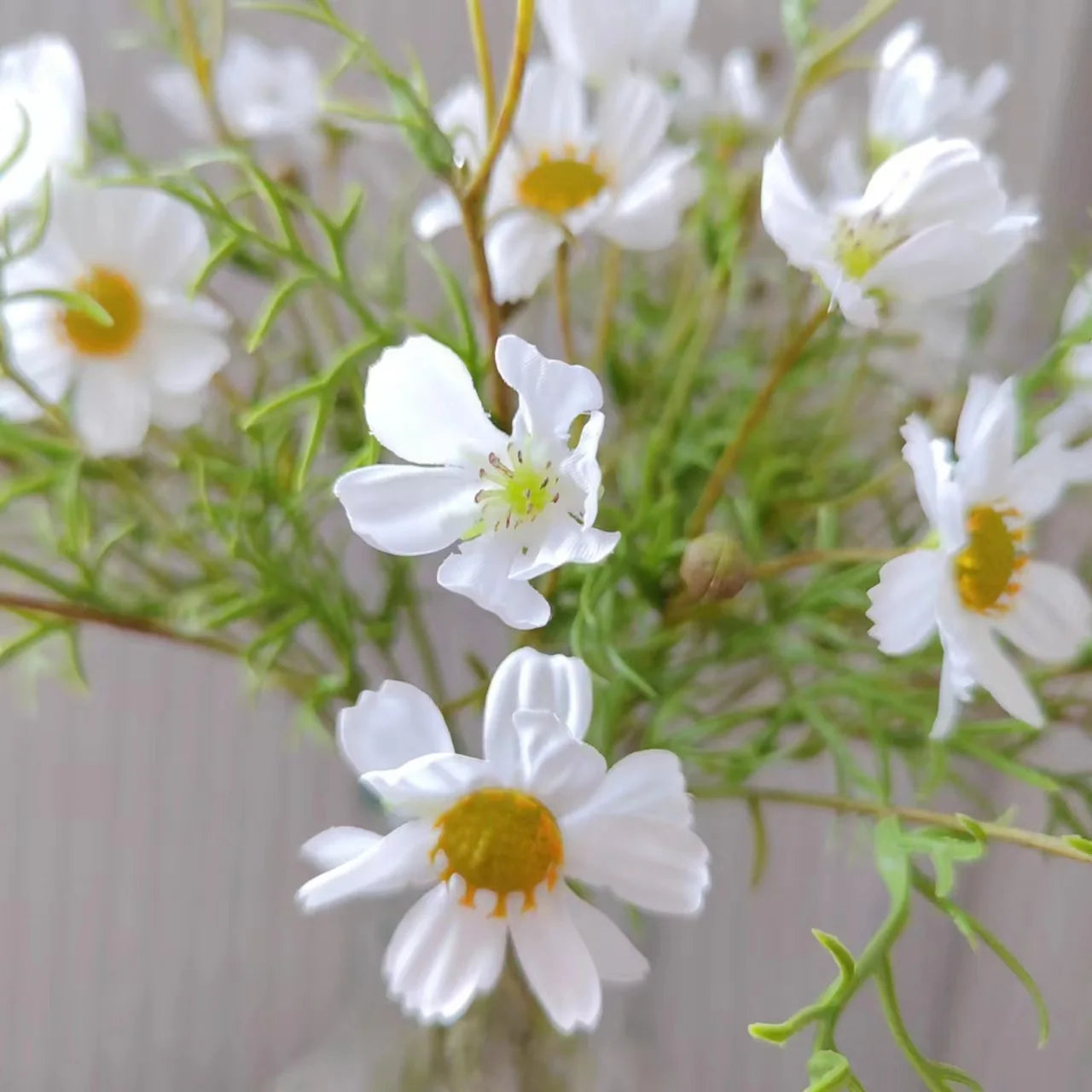 Artificial white flower bouquet with vibrant green stems for home decor and floral arrangements