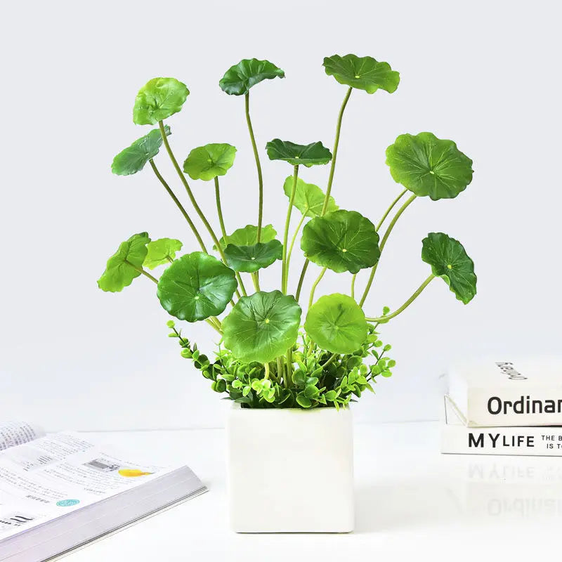 Artificial lotus plants for home decor in a modern white pot with vibrant green leaves