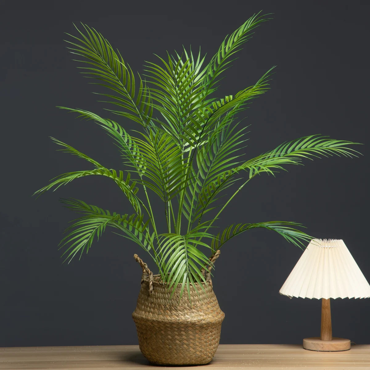 Artificial palm plant in a woven basket, perfect for adding greenery to any room decor