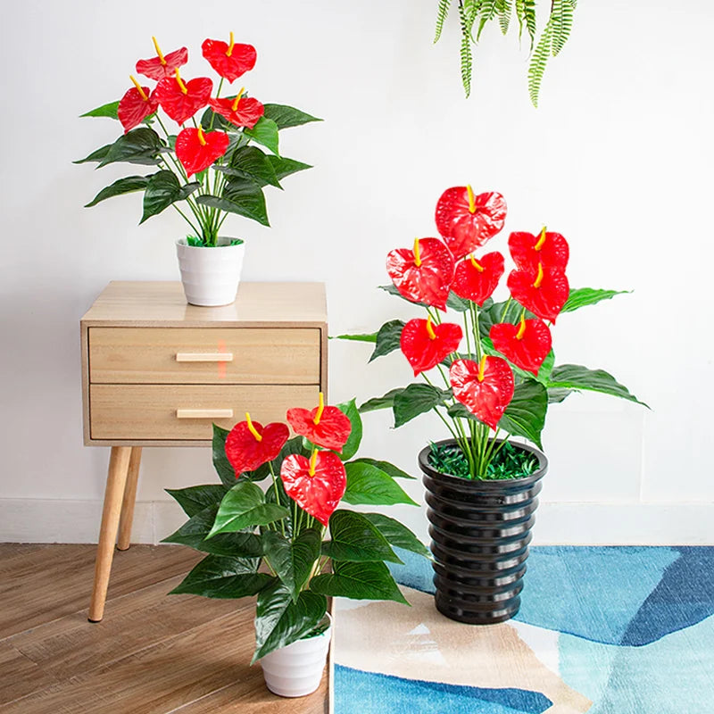 Artificial red anthurium plant in decorative pots for vibrant home decor and indoor gardening
