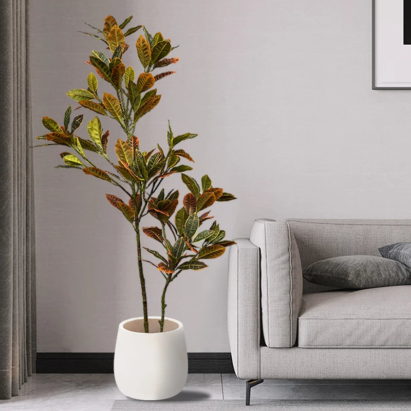 Stylish Mağazam indoor plant in a white pot, adding a touch of greenery to a modern living room