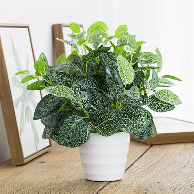 Artificial Leafy Plant in White Pot Perfect for Home Decor and Indoor Spaces
