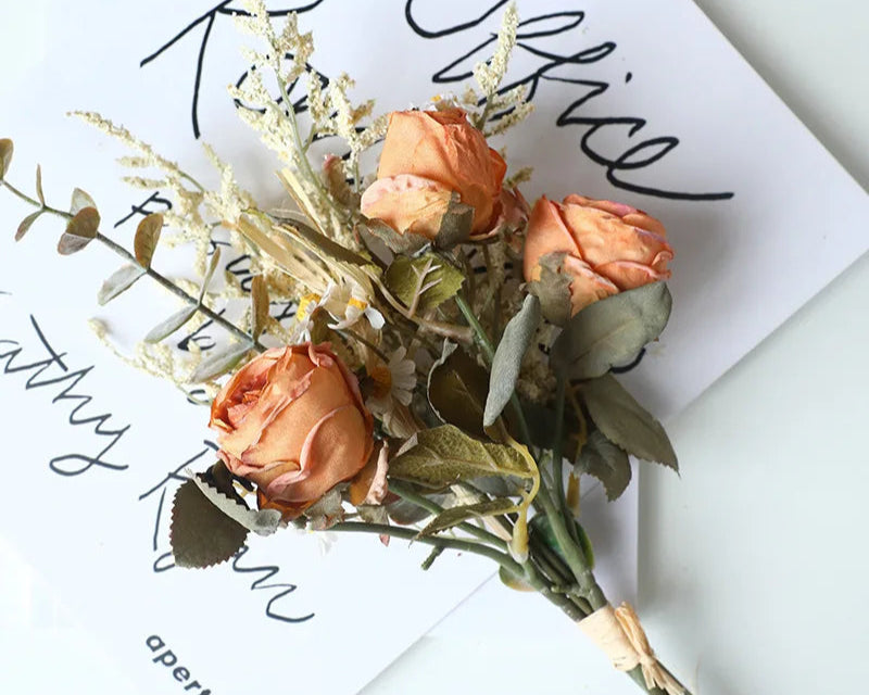 Artificial rose bouquet autumn featuring peach roses and dried greenery for home decor