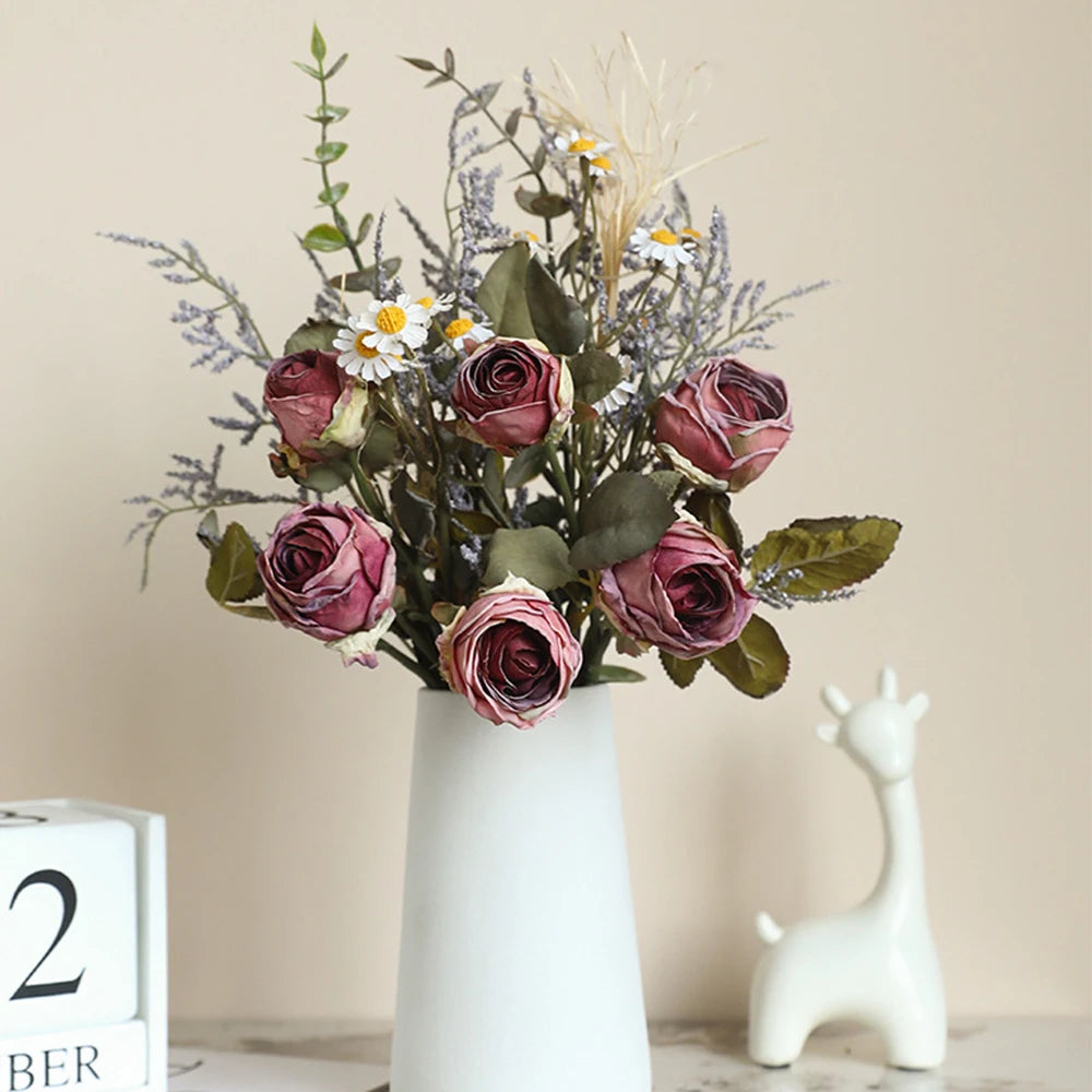 Artificial rose bouquet autumn with pink and lavender flowers in a stylish vase