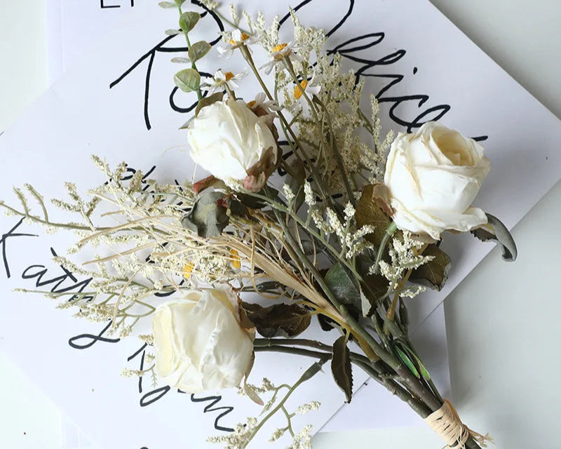 Elegant artificial rose bouquet autumn with white roses and dried foliage for home decor