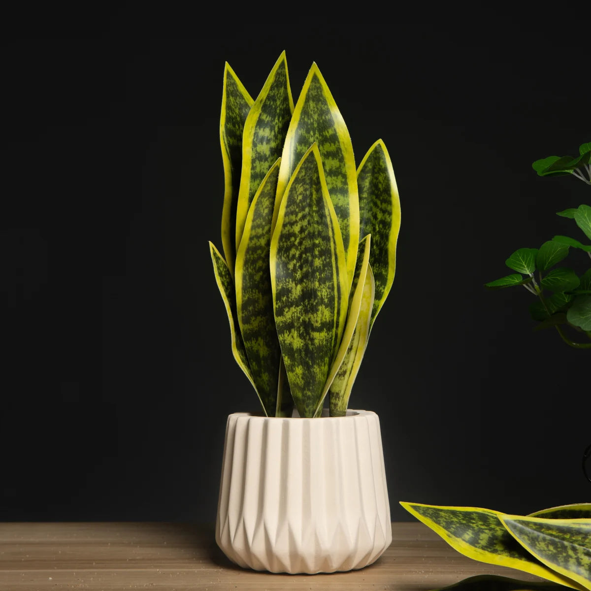 Mağazam artificial snake plant decor in a white ceramic pot with vibrant green leaves