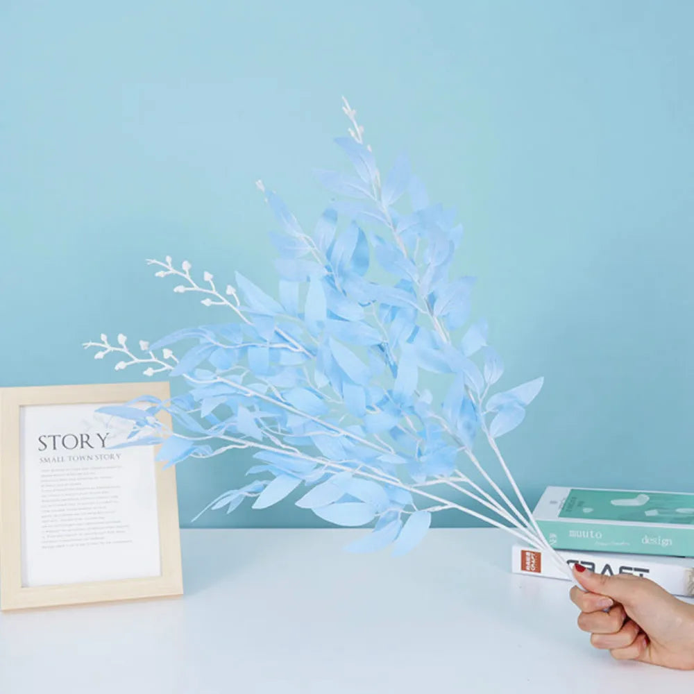 Artificial white flower decoration with delicate blue leaves for home or event styling