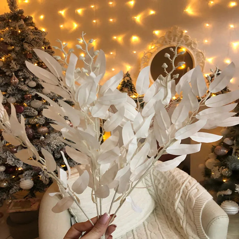 Artificial white flower decoration in hand, perfect for festive home decor and arrangements