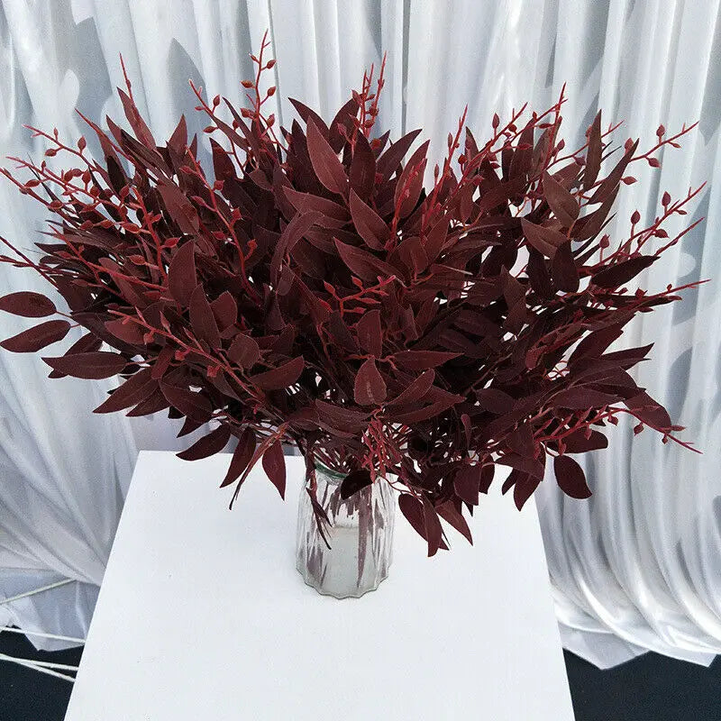 Artificial white flower decoration in a stylish vase, perfect for home or event decor