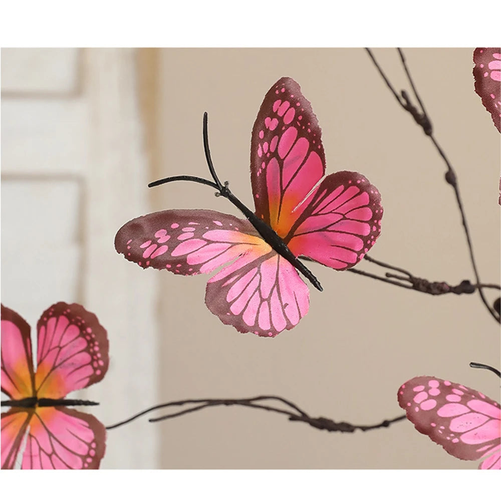 Colorful pink butterfly decor on branches, perfect for home decoration and adding a touch of nature