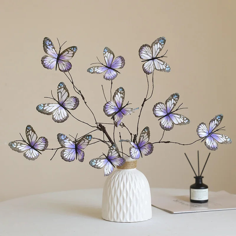 Decorative faux butterfly branch arrangement in a white vase for stylish home decor