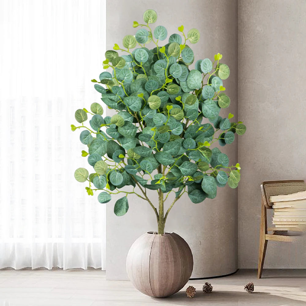 Decorative artificial tree in a round pot, perfect for home or office decor.
