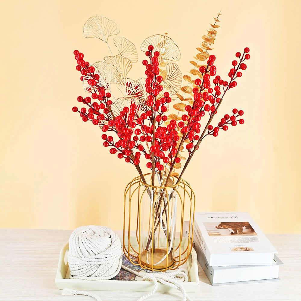 Artificial red berry flower arrangement in a gold wire vase for home decor