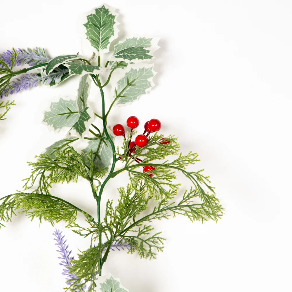 Artificial greenery garland with red berries and purple flowers for festive decorations