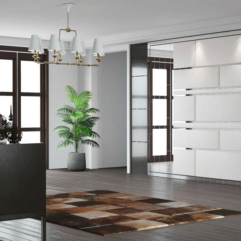 Modern living room interior featuring a chic chandelier, plant, and stylish area rug from Mağazam