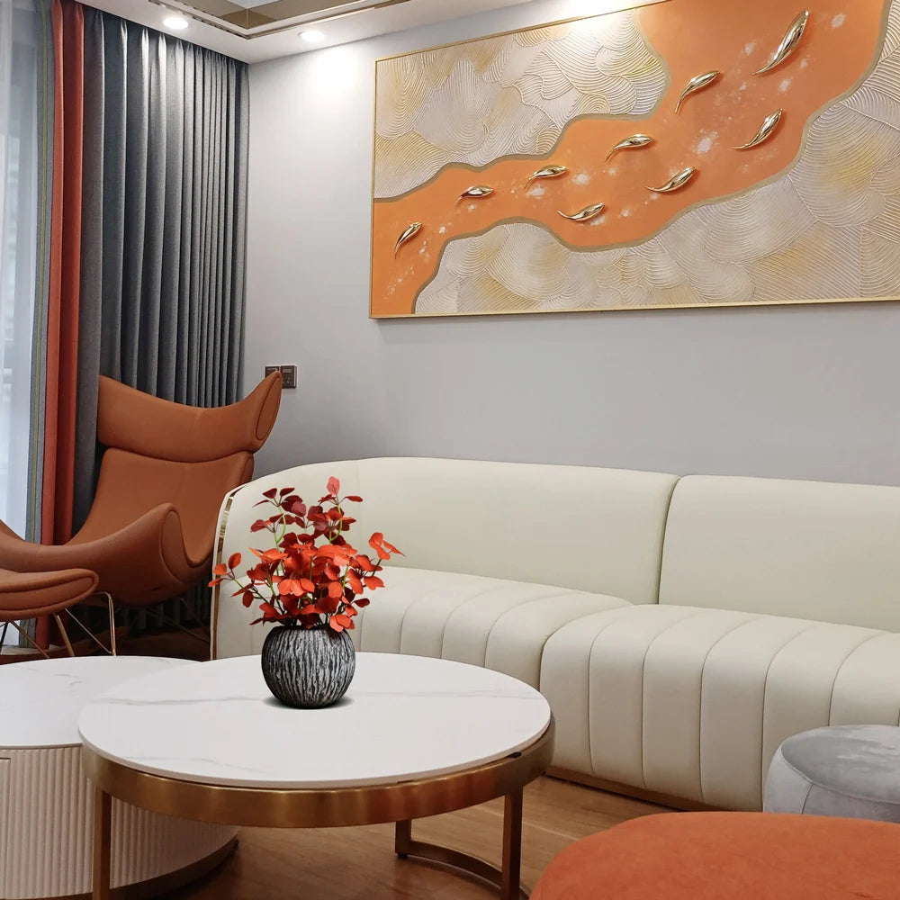 Modern living room setup featuring a white sofa, decorative vase, and abstract wall art by Mağazam