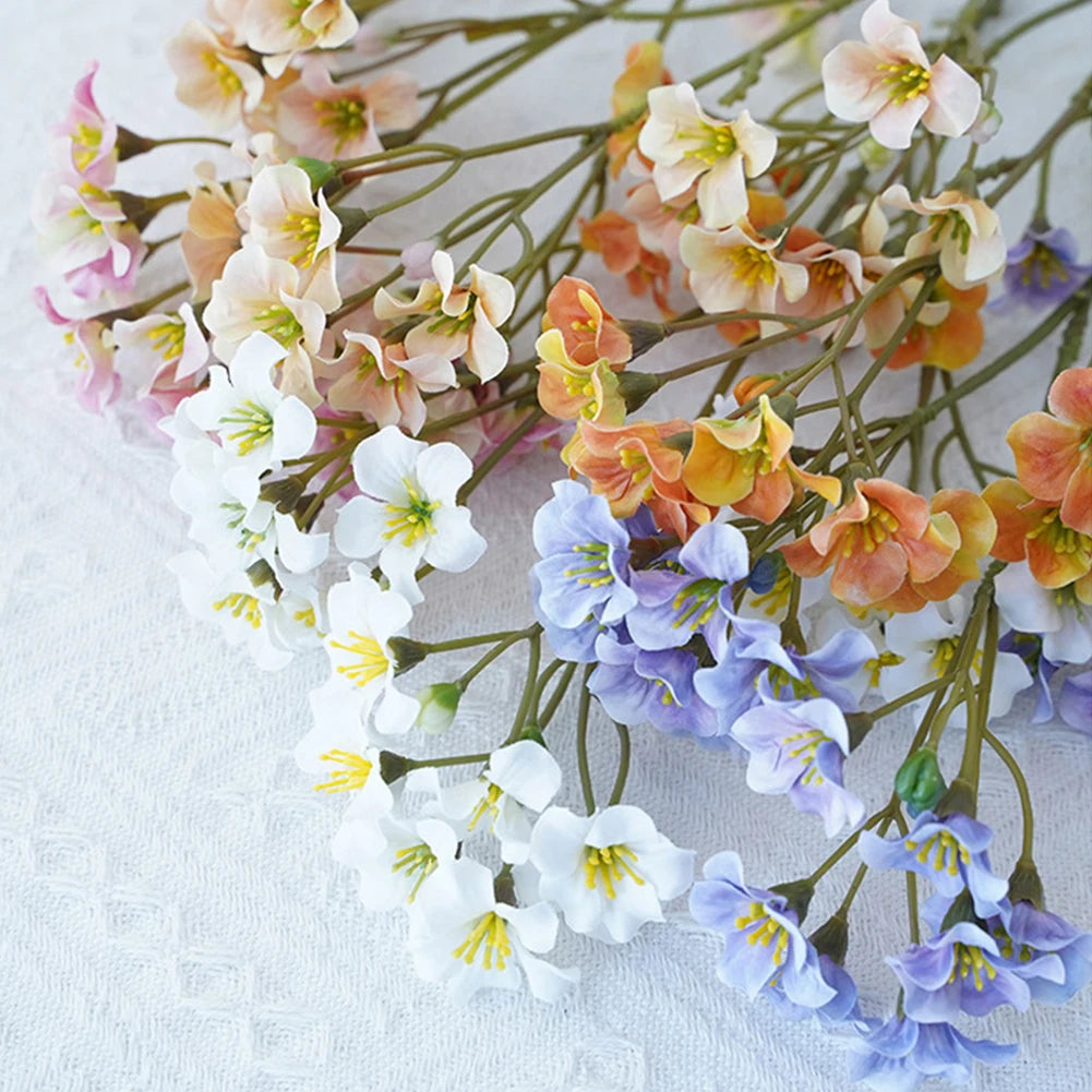 Colorful fake flower table decorations in various shades for elegant home decor