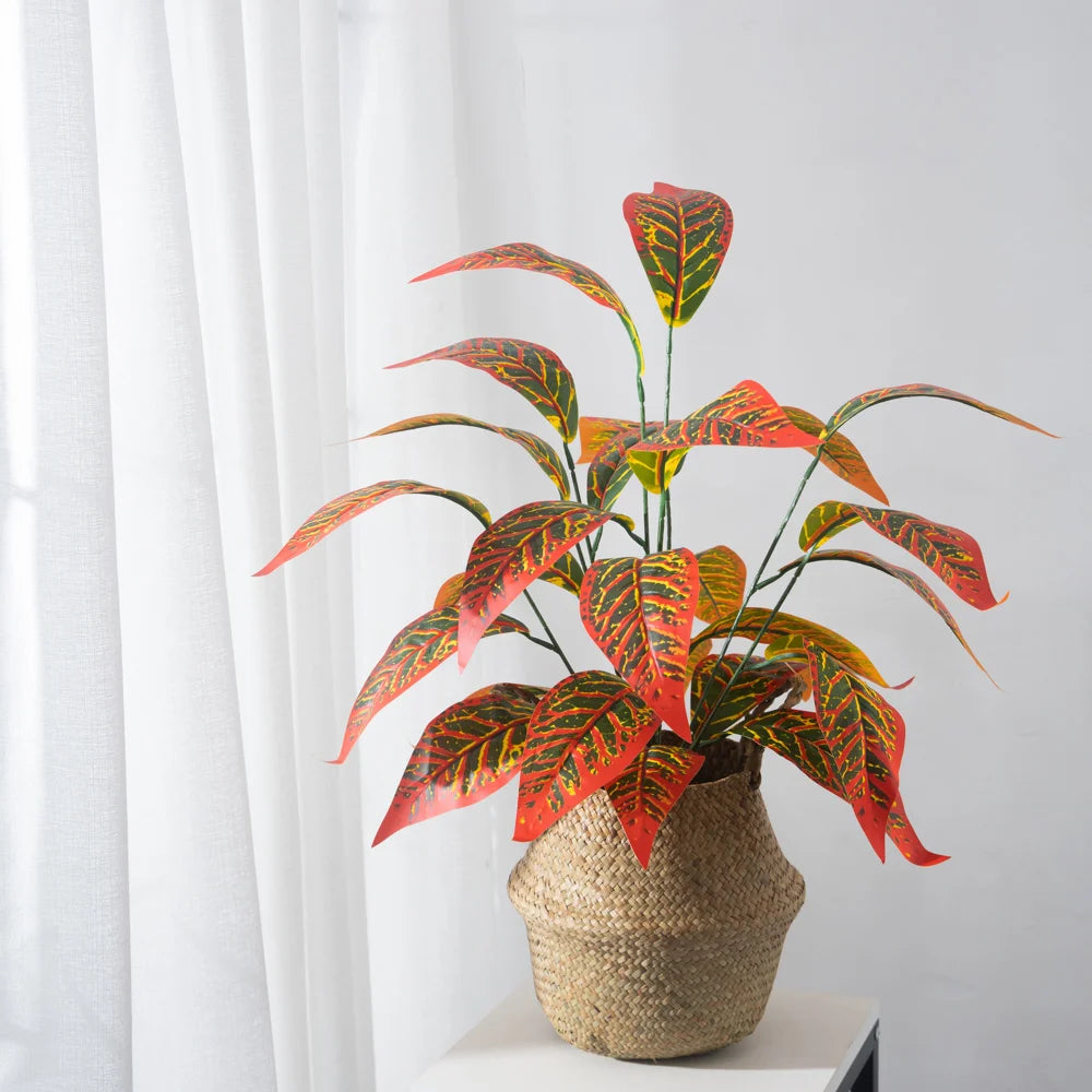 Colorful artificial plant in a woven basket for home decor featuring fake magnolia branch decor