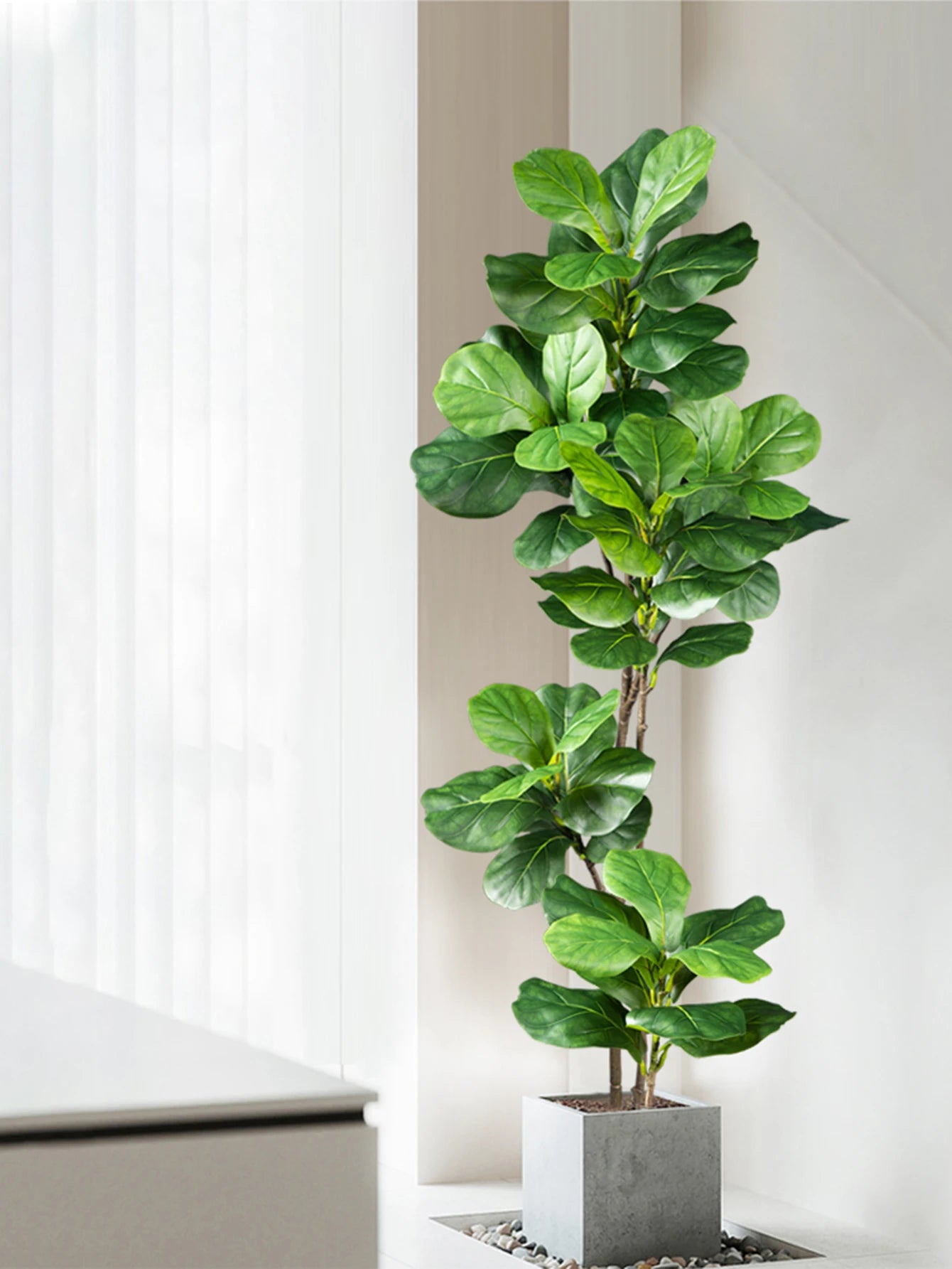 Realistic fake rubber plants for decor in a modern gray pot, enhancing indoor aesthetics