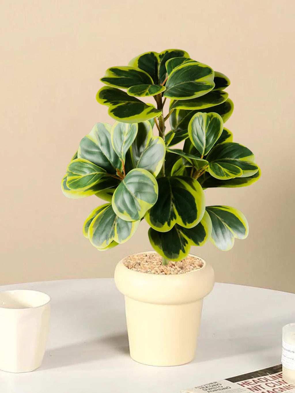 Realistic fake succulent home decor in a cream pot, perfect for stylish interiors