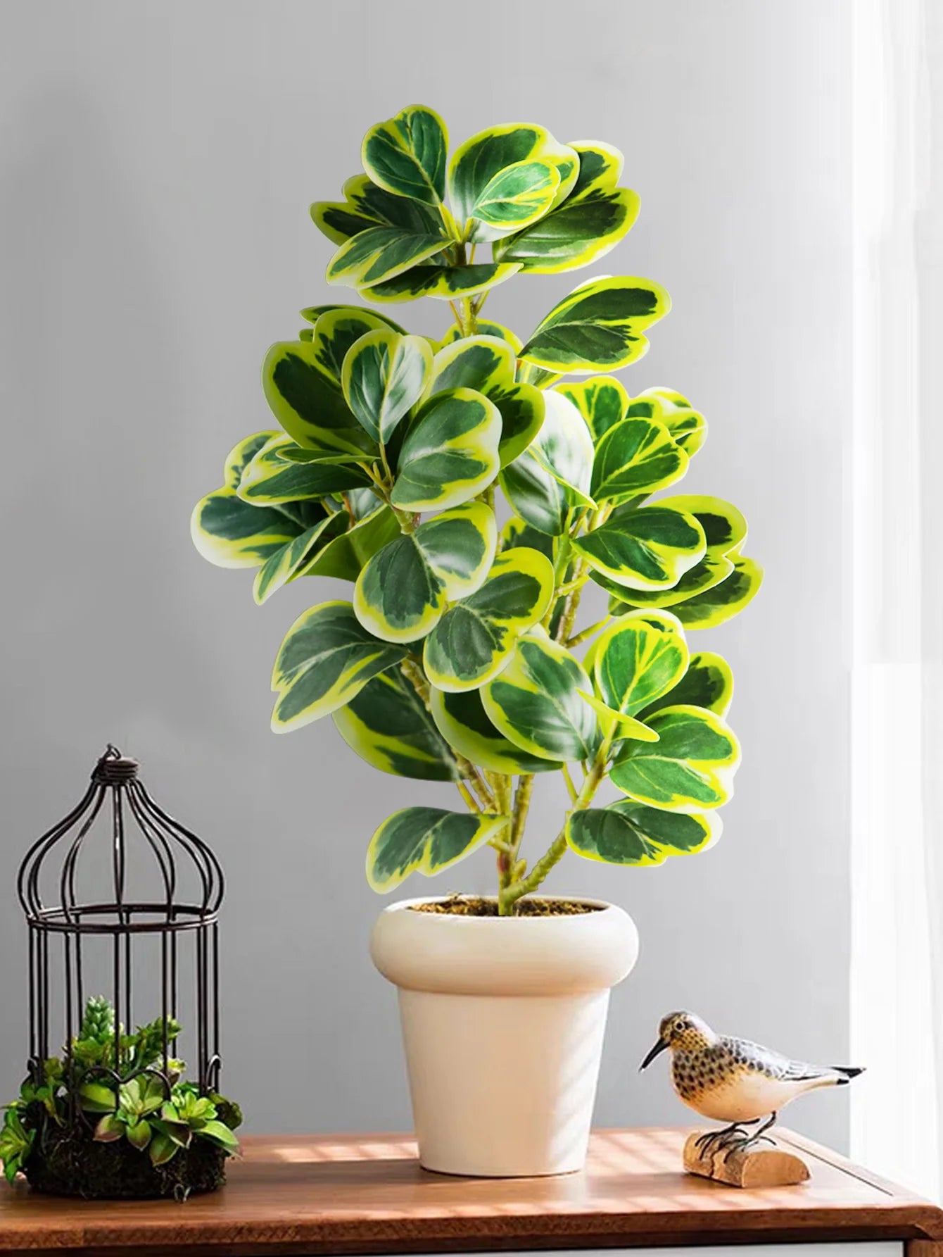 Lifelike fake succulent home decor in a white pot, perfect for adding greenery to any space