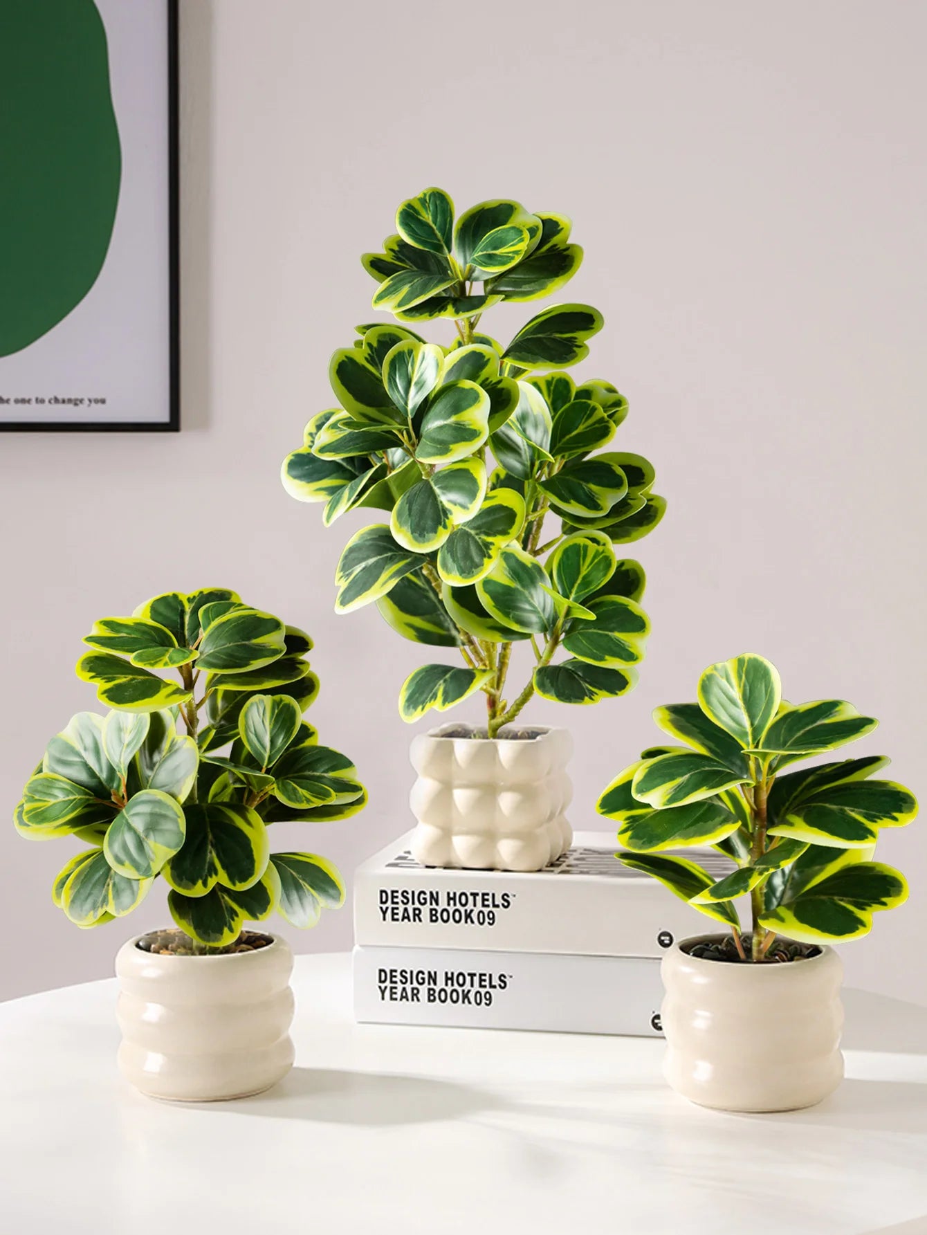 Set of three fake succulent home decor plants in white pots, perfect for modern interior design