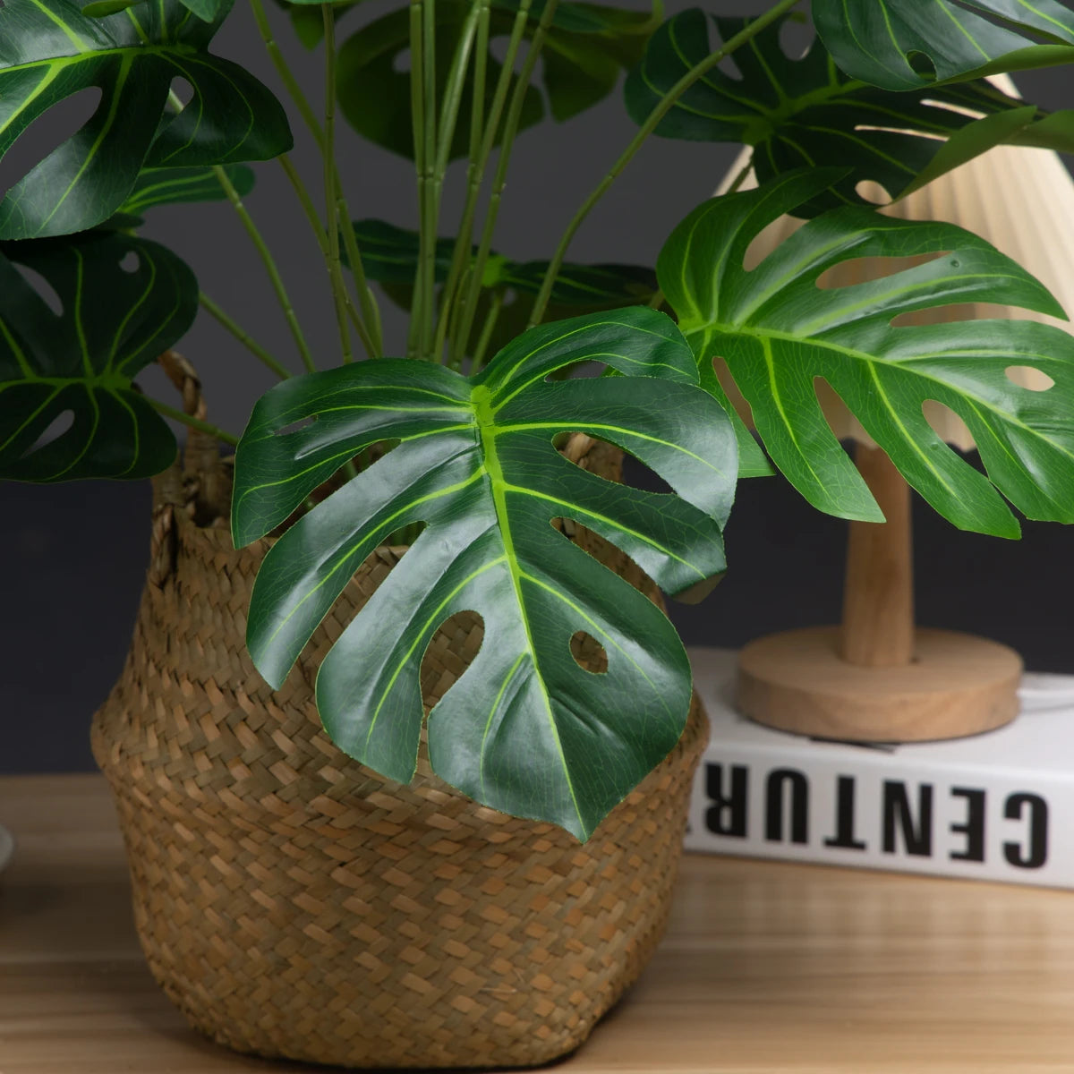 Realistic fake tropical plants for home in a decorative woven basket