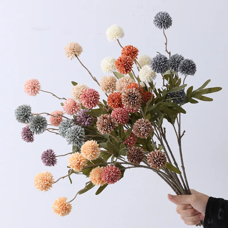 Colorful artificial flower bouquet by Mağazam with soft textured blooms and green foliage