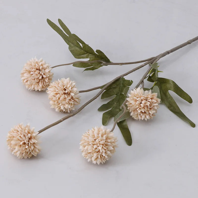 Artificial beige flower stem with round blooms and green leaves for home decor