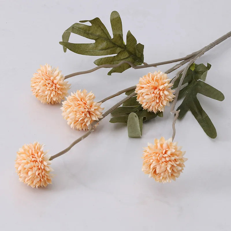 Artificial peach pom pom flowers with green leaves for home decor and floral arrangements