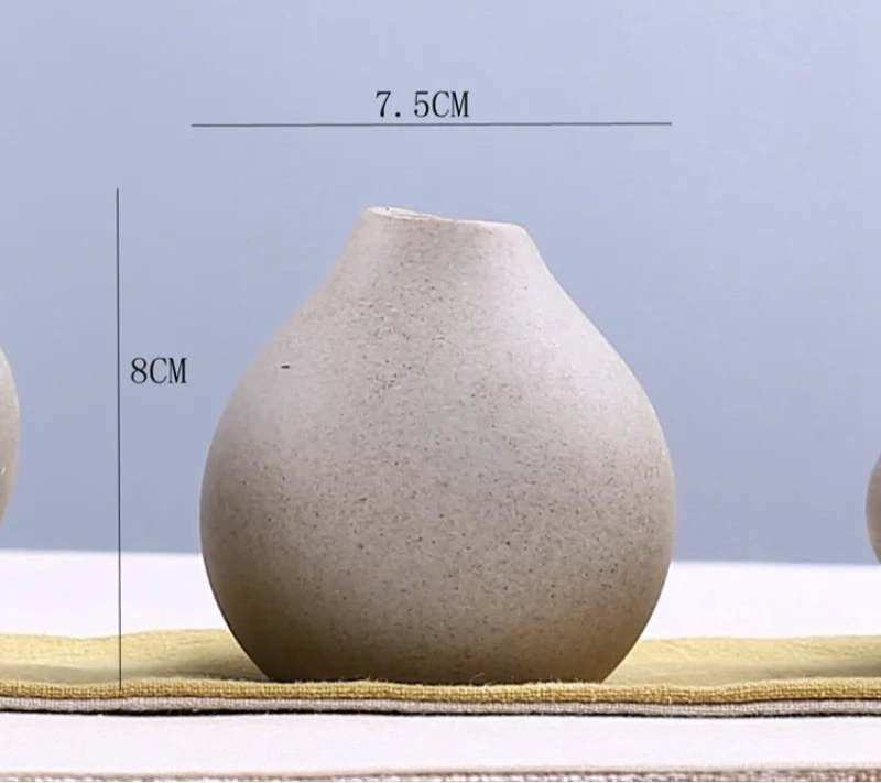 Set of three stylish grand ceramic vases in neutral tones for elegant home decor