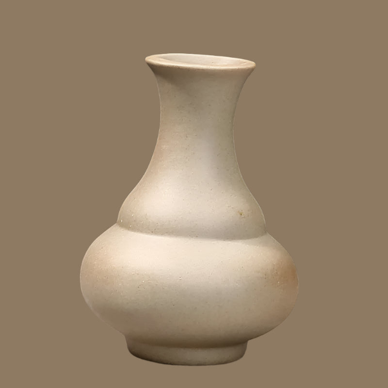 Elegant grand ceramic vases with a unique curvy shape, perfect for home decor and floral arrangements