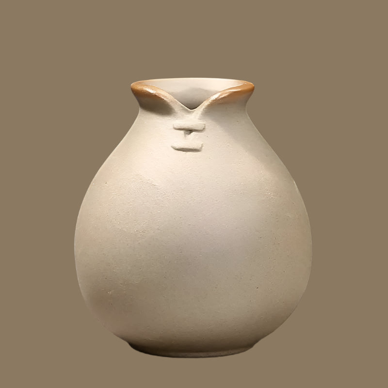Handcrafted grand ceramic vases with a unique shape and tan finish for elegant home decor