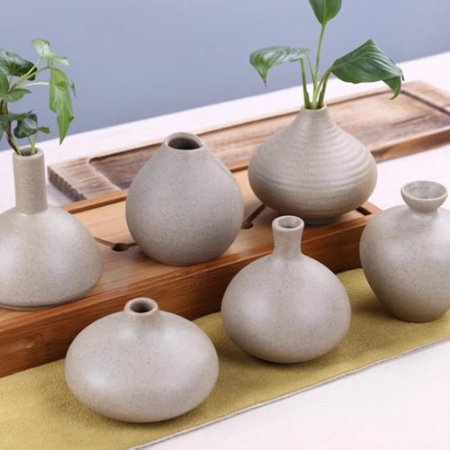 Set of six grand ceramic vases in neutral tones for elegant home decor and floral arrangements