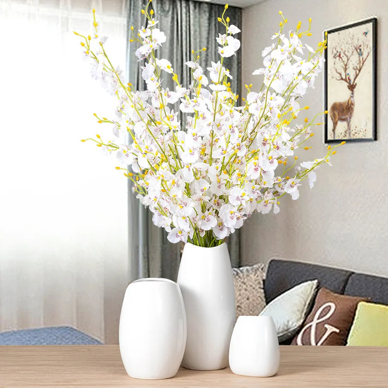 Elegant white orchid flower arrangement in modern vases for stylish home decor