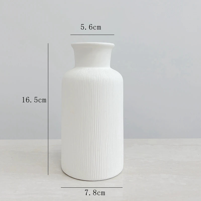 Modern white ceramic jarrones with ribbed texture for elegant home decoration accents