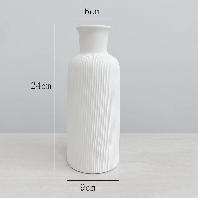 Elegant white ceramic jarrones for home decoration, measuring 24cm tall and 9cm wide