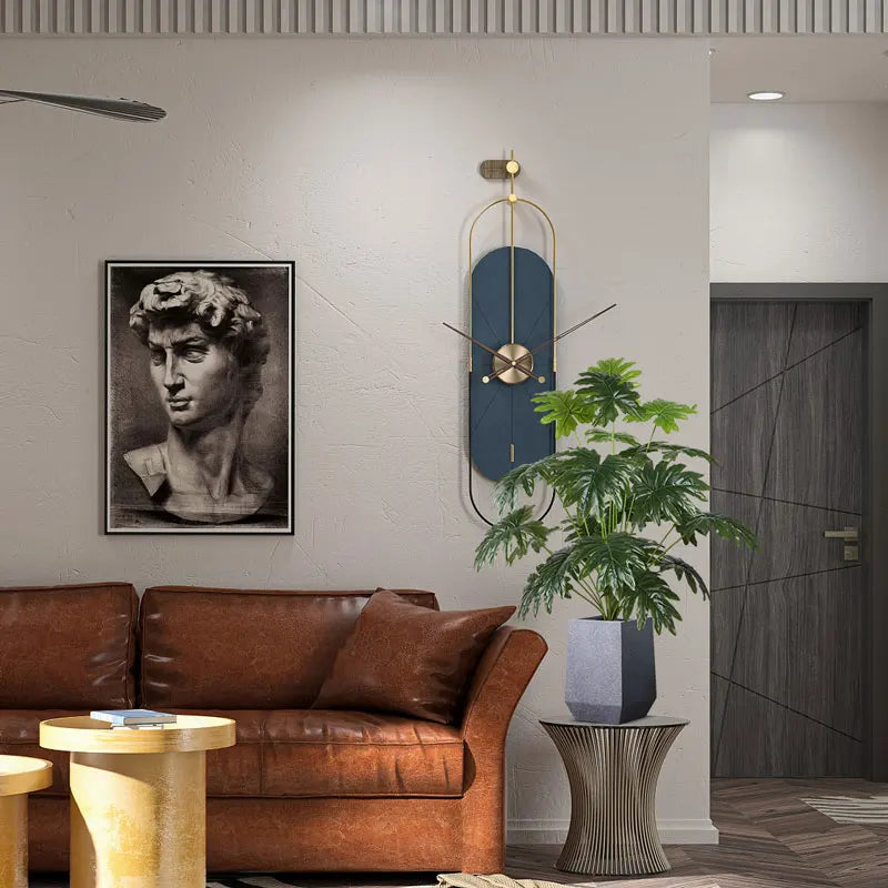 Modern living room with brown leather sofa, decorative plant, and elegant wall art