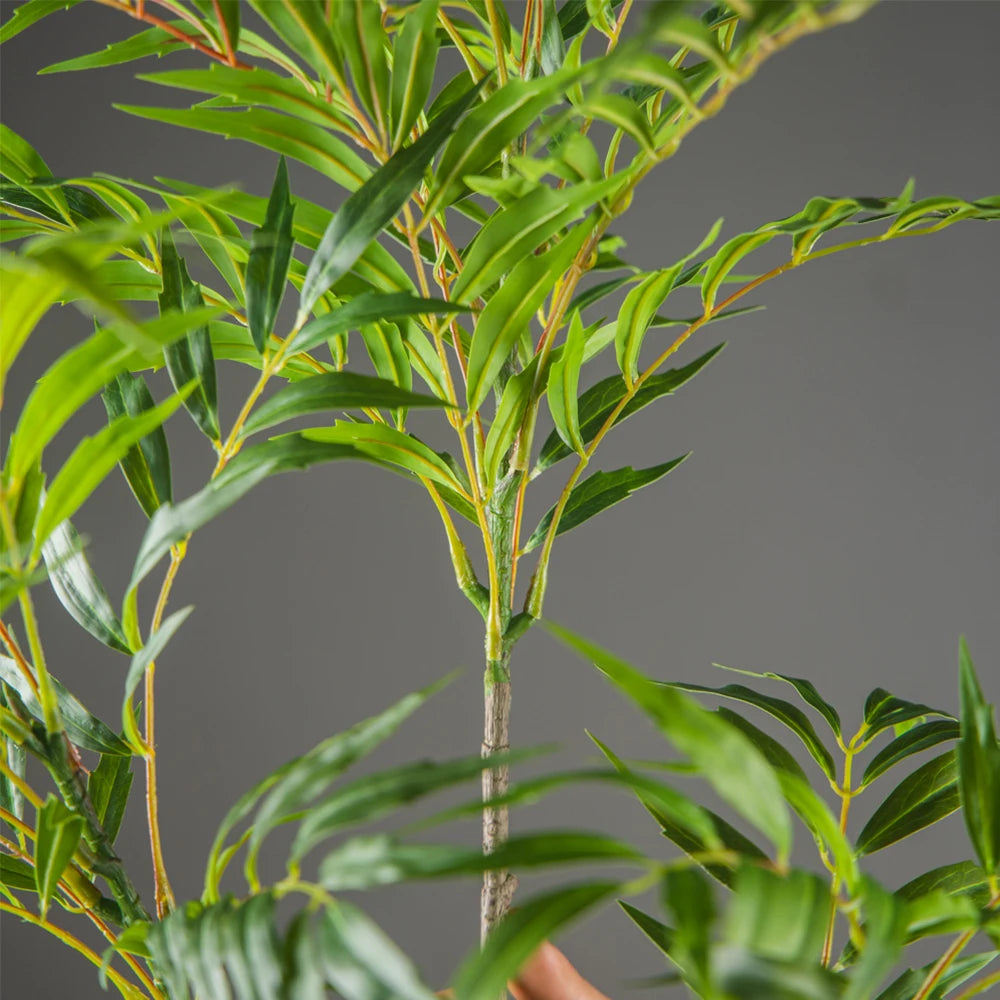 Lifelike artificial plant with lush green leaves for home or office decoration