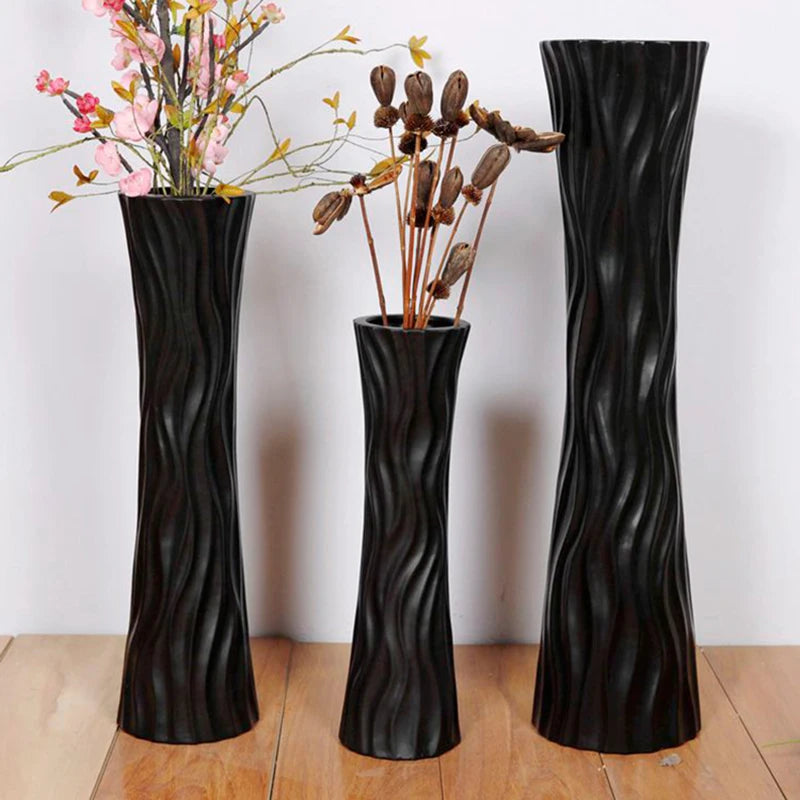 Set of three luxury Ikebana floor vases in elegant black with wavy design for stylish decor